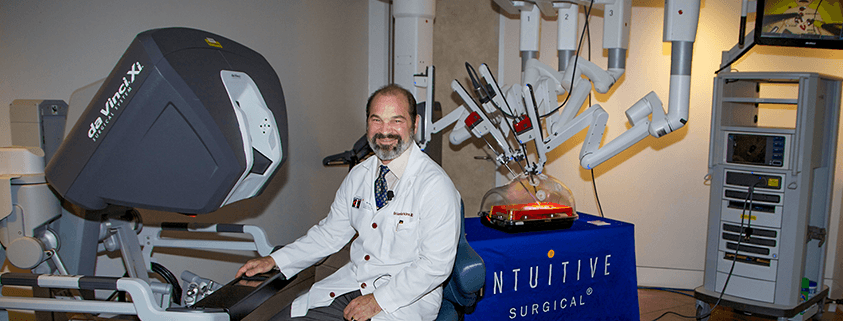 Doctor with da Vinci surgical robot system.