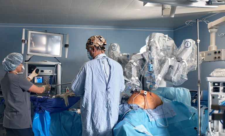 surgeons perform robotic surgery in a hospital